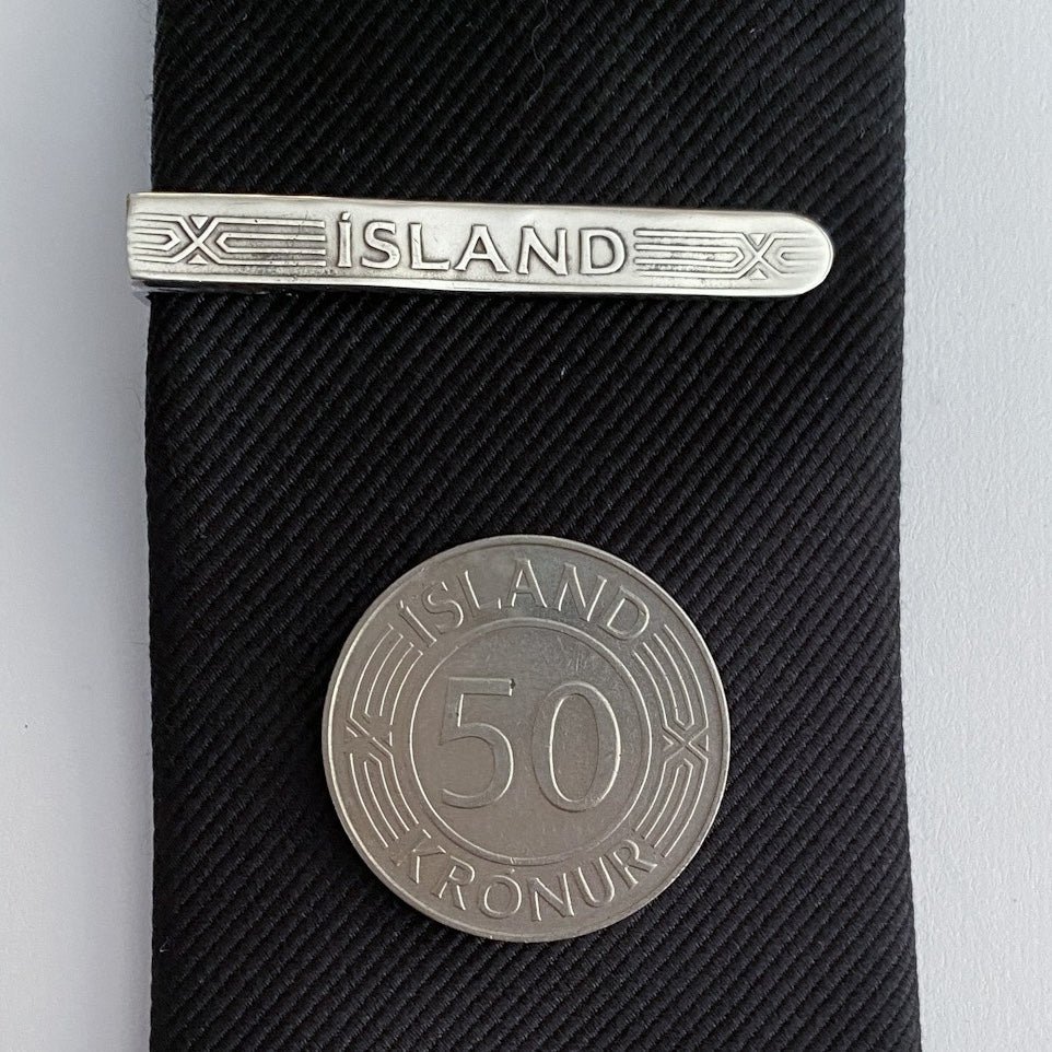 Bindisnæla úr 50 krónum - Silfurlituð